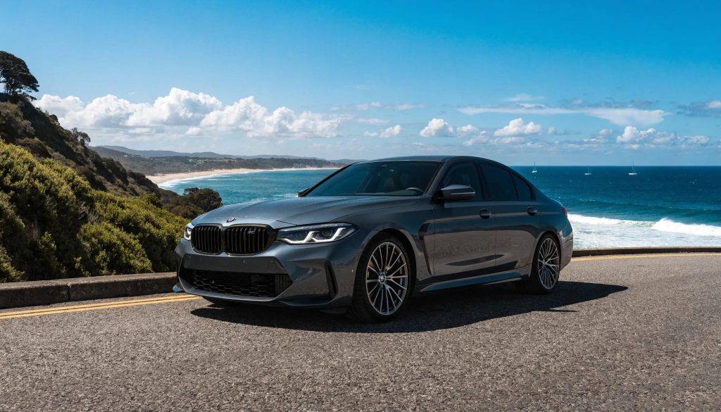 Coastal car detailing in Northern Beaches, showcasing a shiny vehicle against the beach backdrop